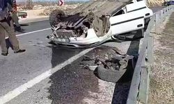 Takla atan otomobilden yara almadan kurtuldu