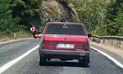 Camdan Ayak Sarkıtan Sürücü Trafiği Tehlikeye Attı
